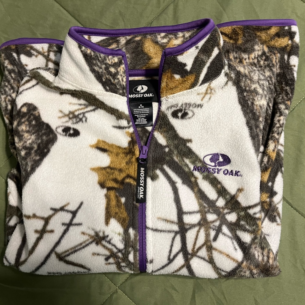 Mossy Oak Fleece Jacket with Thumb Holes on Sleeves and Purple Trim.